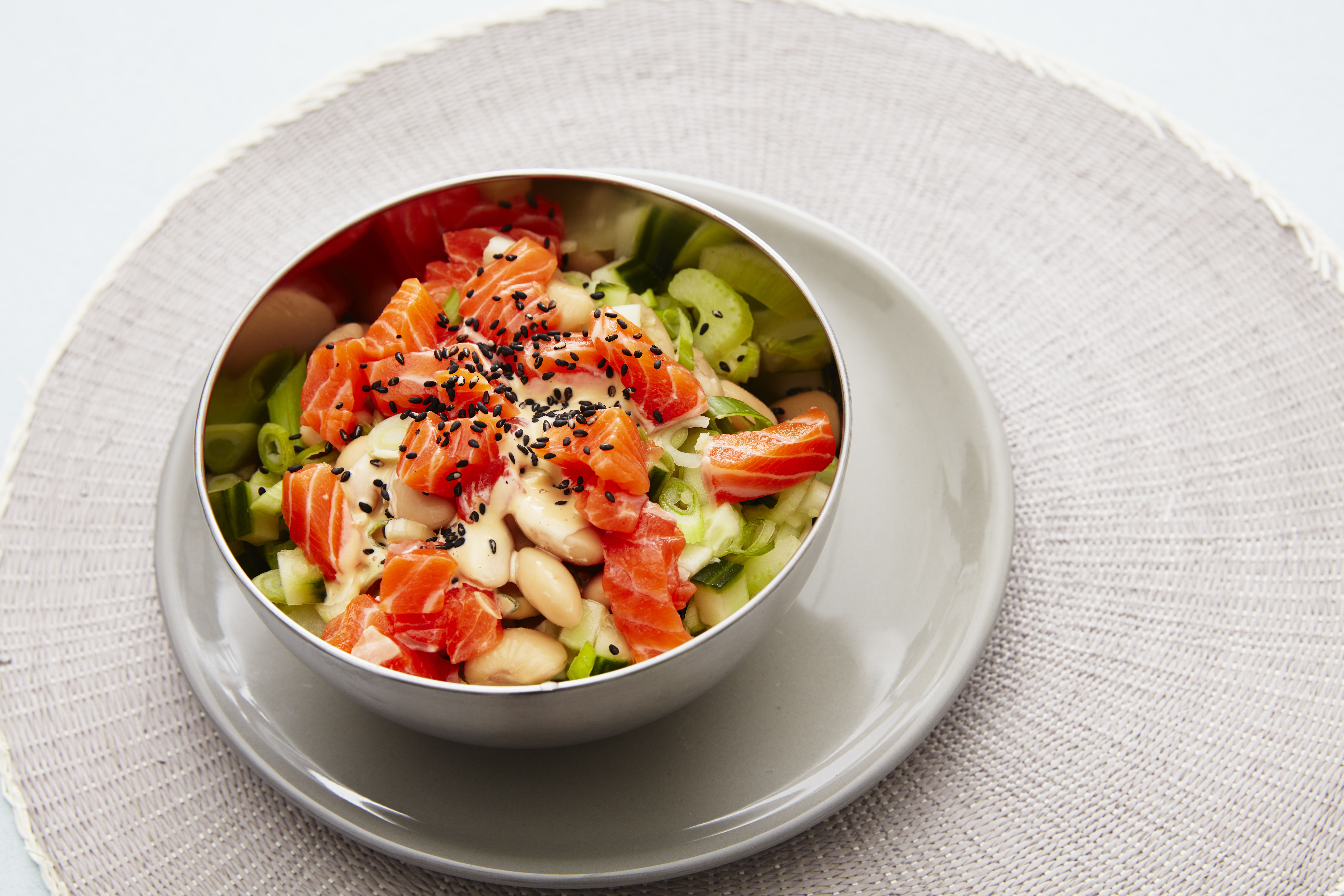 Poké bowl with trout, spring onion and white beans